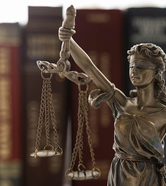 lady justice with law books in the background